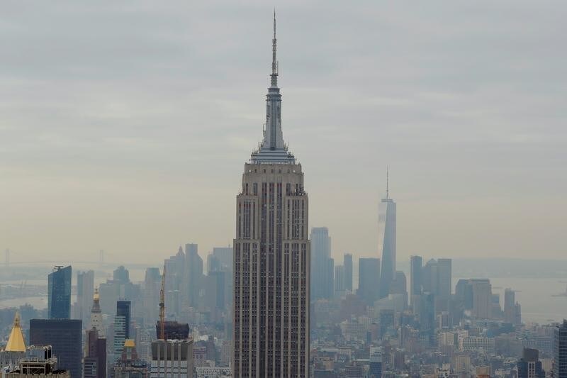 The Empire State Building and One World Trade rise over Manhattan as viewed from the Top of the Rock observation deck in New York, U.S., February 14, 2018. REUTERS/Lucas Jackson - RC1BA53888D0