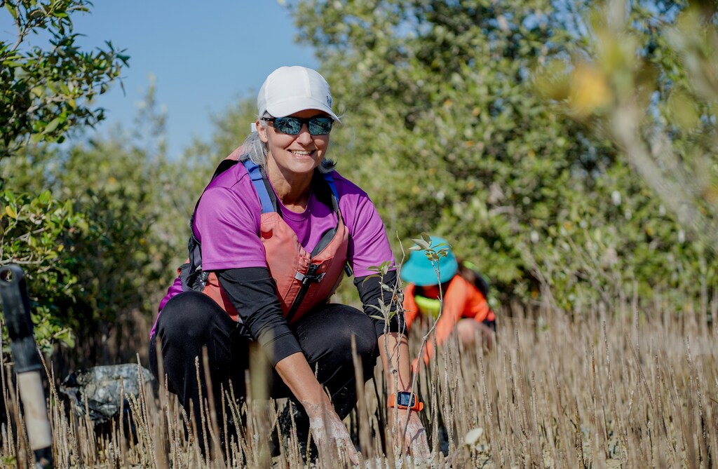 Dr. Sonia Ben Jaafar, CEO of the Abdulla Al Ghurair Foundation, at a mangrove restoration activity which is part of the Abdulla Al Ghurair Greening Communities Initiative in Abu Dhabi.