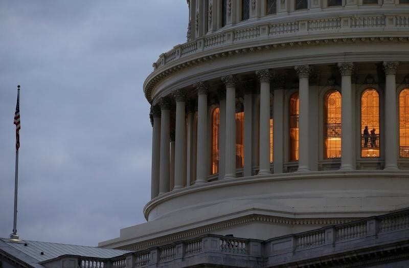 The U.S. Capitol building is lit at dusk ahead of planned votes on tax reform in Washington, U.S., December 18, 2017. REUTERS/Joshua Roberts - RC1DCABBC690