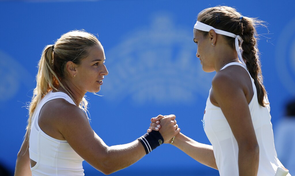 Britain Tennis - Aegon International - Devonshire Park, Eastbourne - 24/6/16Slovakia's Dominika Cibulkova shakes hands with Puerto Rico's Monica Puig (R) after victory in the semi finalAction Images via Reuters / Peter CziborraLivepicEDITORIAL USE ONLY. - RTX2I11A