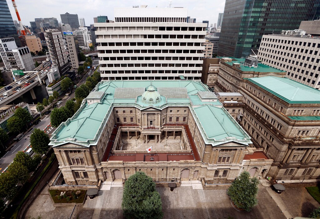 Japanese national flag is hoisted atop the headquarters of Bank of Japan in Tokyo, Japan September 20, 2023. REUTERS/Issei Kato