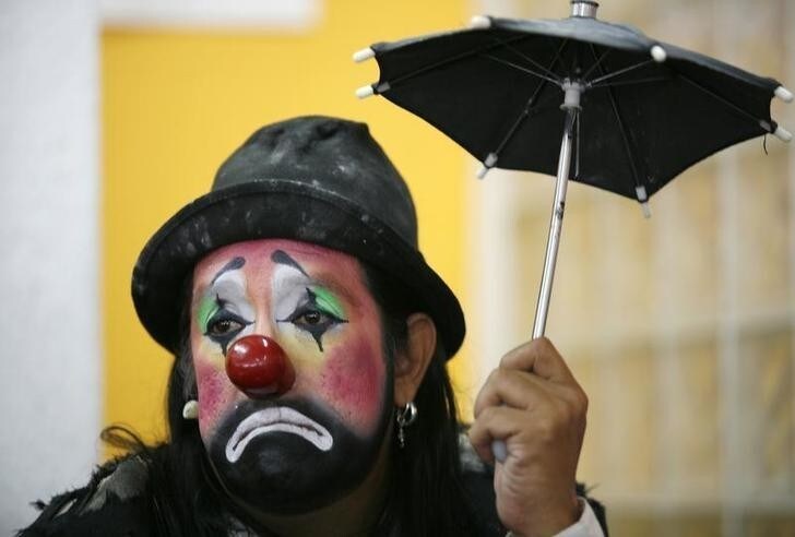 A clown looks on during a news conference in Mexico City October 14, 2009. Mexico will host the 14th Latin American Clown Convention from October 19 to October 22. REUTERS/Eliana Aponte (MEXICO SOCIETY)