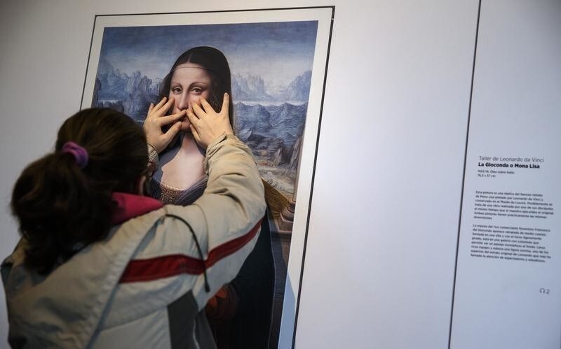 A visually impaired visitor touches a work representing Leonardo da Vinci's Mona Lisa, at an exhibition called "Touching the Prado" at the Prado museum in Madrid, February 13, 2015. The exhibit allows for paintings to be perceived by touching them, which according to the museum's website, will allow the works to be perceived mentally and provide an emotional perception. Six works representative of different pictorial genres found in the museum's collections make up the touchable exhibit.