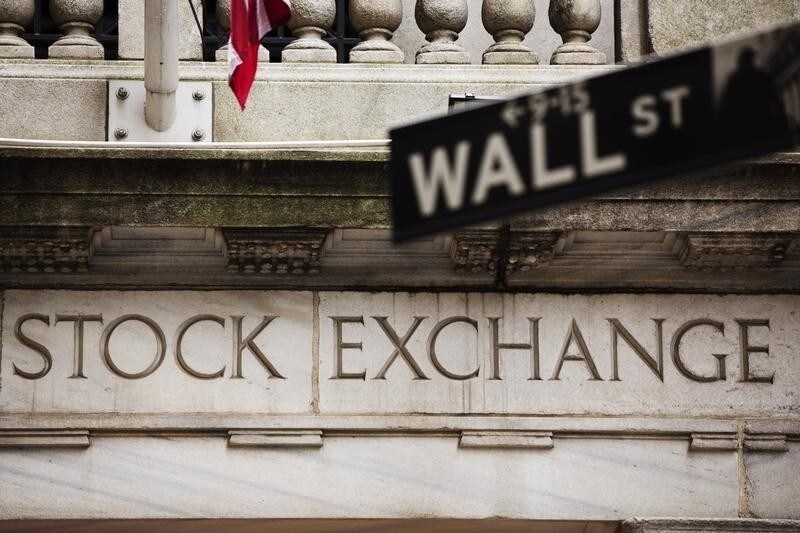 A street sign for Wall Street hangs in front of the New York Stock Exchange May 8, 2013. Stocks pushed further into record territory on Wednesday, driving the S&P 500 to an all-time high close for a fifth day, helped by strength in financials and technology. REUTERS/Lucas Jackson (UNITED STATES - Tags: BUSINESS) - RTXZFHC