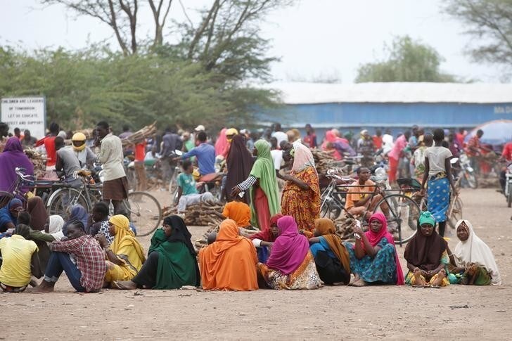 Women wait in line to receive aid at the Kakuma refugee camp in northern Kenya, March 6, 2018. Picture taken March 6, 2018. REUTERS/Baz Ratner
