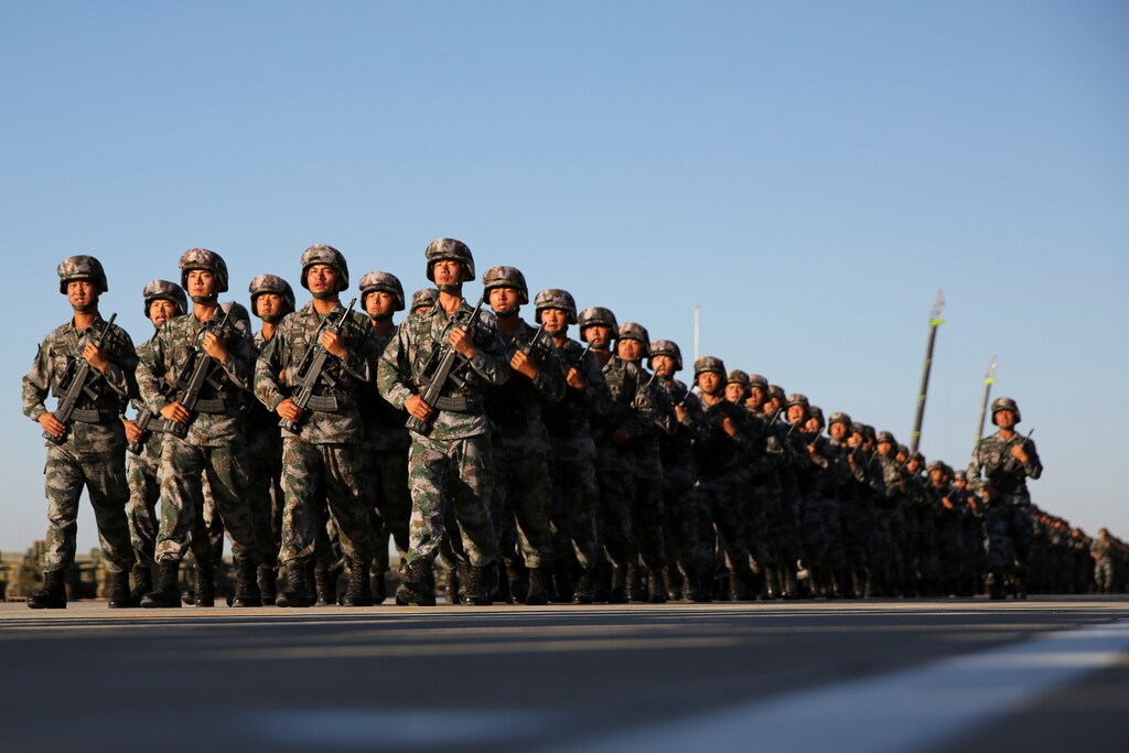 Soldiers arrive for a military parade to commemorate the 90th anniversary of the foundation of China's People's Liberation Army (PLA) at the Zhurihe military training base in Inner Mongolia Autonomous Region, China, July 30, 2017. REUTERS/Stringer ATTENTION EDITORS - THIS IMAGE WAS PROVIDED BY A THIRD PARTY. CHINA OUT. NO COMMERCIAL OR EDITORIAL SALES IN CHINA. - RC1A4C86AD40