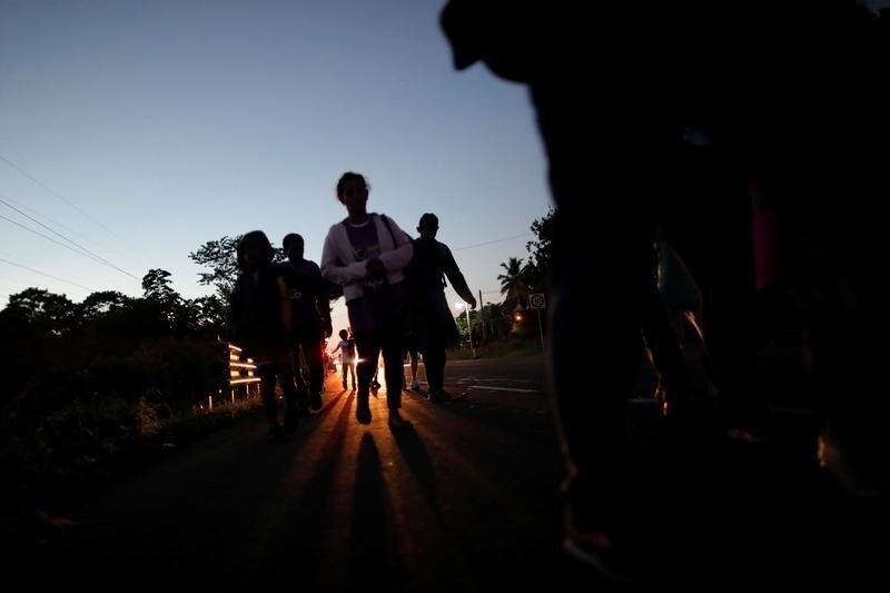 Central American migrants walk along the highway near the border with Guatemala, as they continue their journey trying to reach the U.S., in Tapachula, Mexico October 22, 2018.