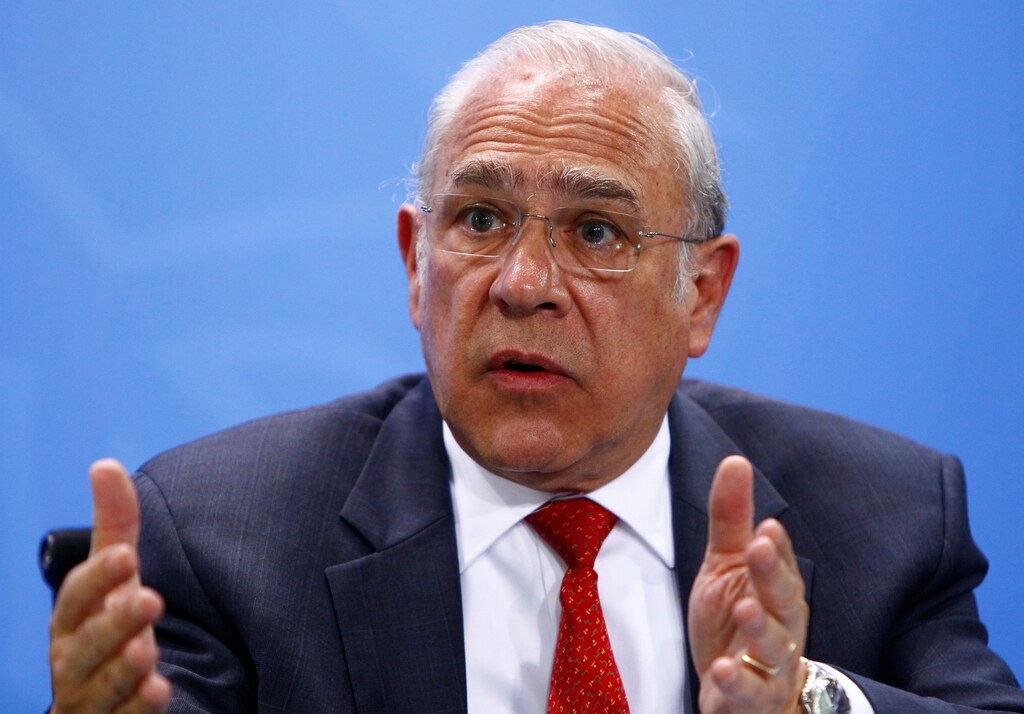 Jose Angel Gurria, Secretary-General of the Organisation for Economic Co-operation and Development (OECD) gestures as he attends a news conference with representatives of the trade organizations after a meeting in the chancellery in Berlin, Germany, June 11, 2018. REUTERS/Michele Tantussi - RC172B20E6B0