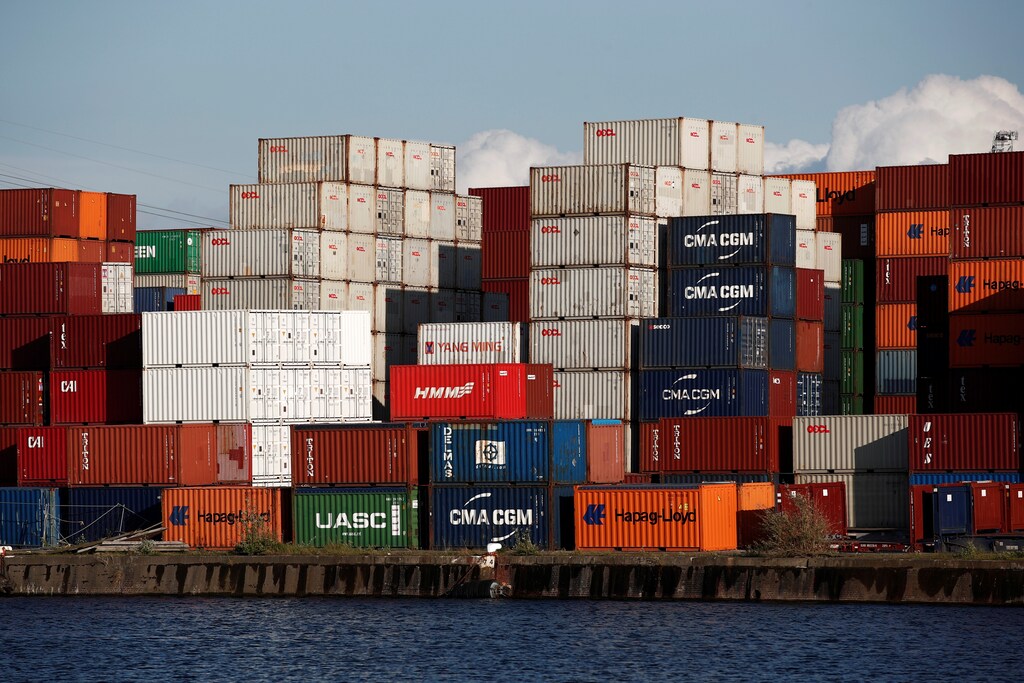 Shipping containers sit stacked in the Port of Le Havre, France, May 9, 2019. REUTERS/Benoit Tessier - RC18099B07A0