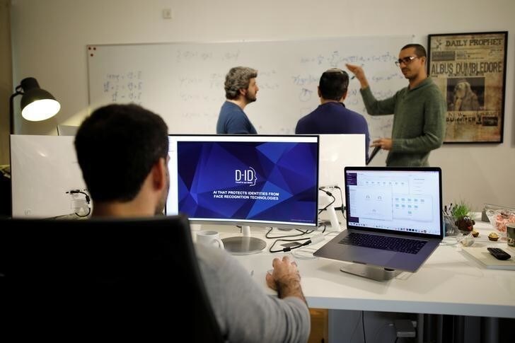 Employees of the D-ID startup company work at the company's office in Tel Aviv, Israel February 7, 2018. Picture taken February 7, 2018. REUTERS/Amir Cohen