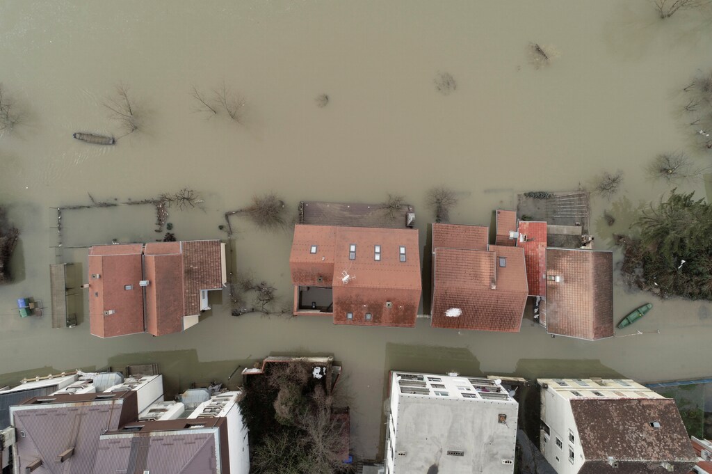 flooded houses are seen in Hrvatska Kostajnica, Croatia. Flooding like this has also happened in recent months and is a big indication of today's climate crisis.