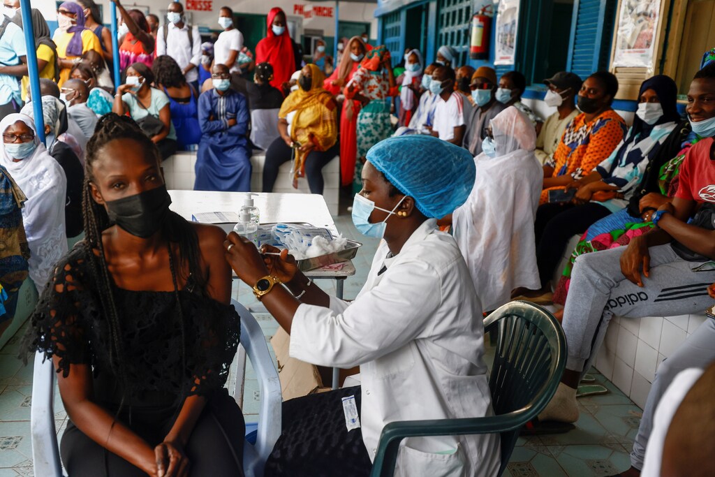 Aminata Laye Diagne, a nurse gives a dose of coronavirus disease (COVID-19) vaccine to a woman at Philippe Senghor Hospital in Dakar, amid a surge of coronavirus disease (COVID-19) cases in Senegal July 28, 2021. Picture taken July 28, 2021.