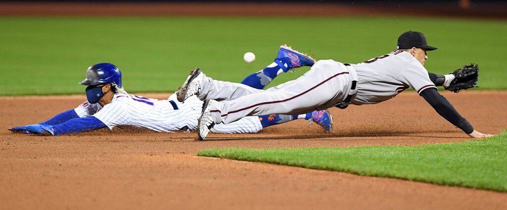 May 8, 2021; New York City, New York, USA; New York Mets shortstop Francisco Lindor (12) steals second base as Arizona Diamondbacks shortstop Nick Ahmed (13) dives for the ball in the third inning at Citi Field. Mandatory Credit: Dennis Schneidler-USA TODAY Sports TPX IMAGES OF THE DAY - 16051466