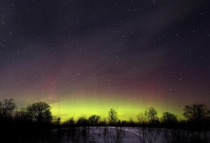 The glow of the Aurora Borealis, or Northern Lights, is seen in the horizon in the Kawartha Lakes region, southern Ontario February 23, 2015. The colorful cosmic display of the northern lights is rarely seen in Ontario.