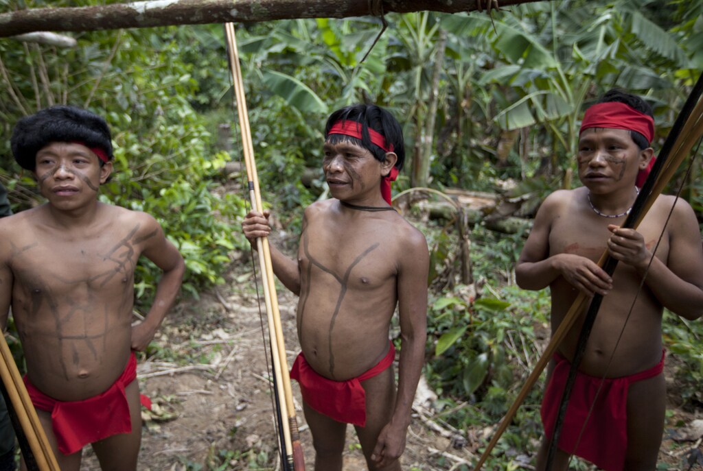 Yanomami Indians at the community of Irotatheri, are pictured during a government trip for journalists, as they wait to perform a dance to welcome an investigative commission, in the southern Amazonas state of Venezuela, just 19km (12 miles) from Brazil's border, September 7, 2012. The Venezuela government and indigenous groups are disputing whether an alleged massacre of Amazon villagers took place after the government said it found no evidence of an attack. A group representing the Yanomami tribe last week said that Brazilian gold miners had crossed the border and attacked a village from a helicopter. Venezuelan officials said over the weekend that flyovers of the area led them to believe that the allegations were false. Picture taken September 7, 2012. REUTERS/Carlos Garcia Rawlins (VENEZUELA - Tags: POLITICS SOCIETY) - GM1E89919QN01
