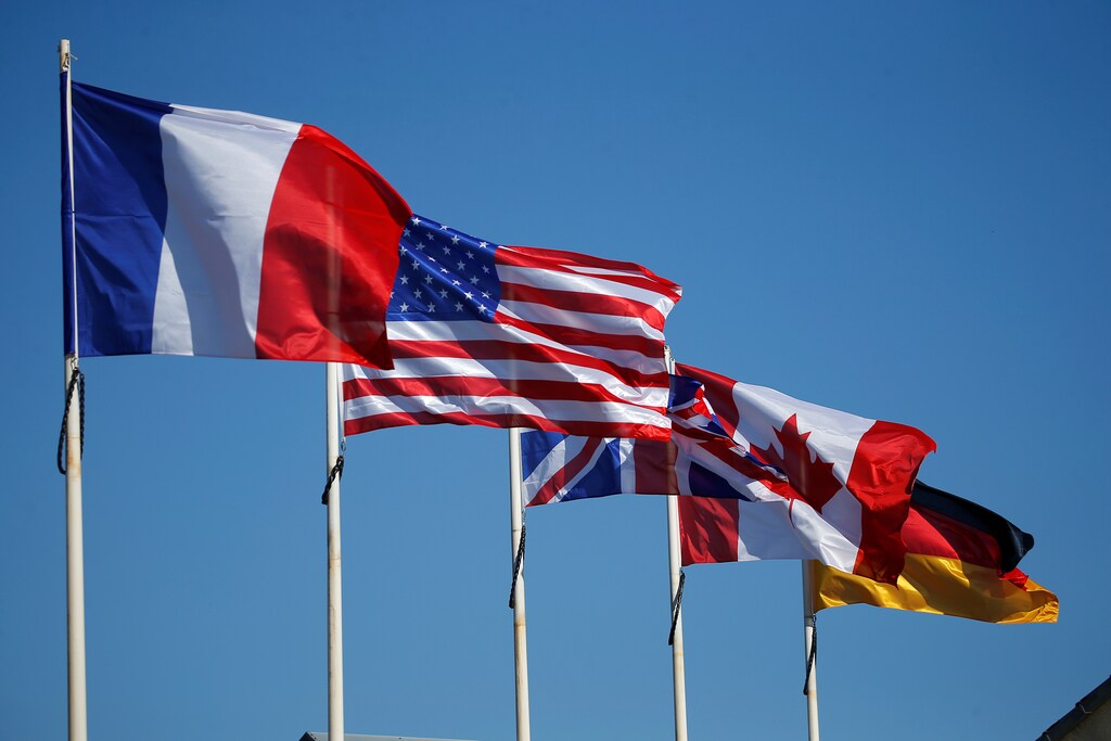 French, American, British Union Jack, Canadian, and German flags are pictured in front of the World War II museum in Quineville, in the Normandy region, France, March 25, 2019. France prepares to commemorate the 75th anniversary of the D-Day, the World War II Allied landings and the Battle of Normandy. Picture taken March 25, 2019. REUTERS/Stephane Mahe - RC137B88F8B0