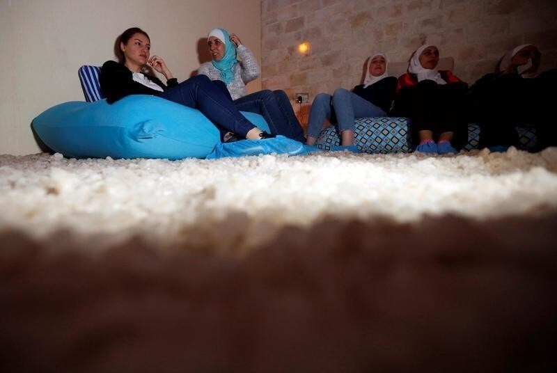 A group sits in the salt cave before a meditation session in Amman, Jordan, March 28, 2018. Picture taken March 28, 2018.