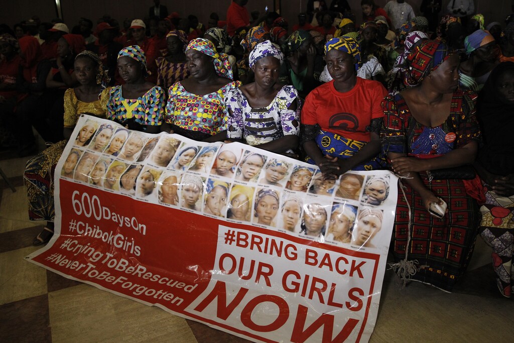 Parents of the Chibok girls hold a "Bring Back Our Girls" banner.