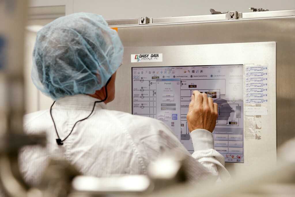 Lead Protein Production and Centrifugation scientist Paul Koelle operates a centrifuge control panel where they are working on developing a vaccine for the Zika virus based on production of recombinant variations of the E protein from the Zika virus at the Protein Sciences Inc. headquarters in Meriden, Connecticut, June 20, 2016. Picture taken June 20, 2016. REUTERS/Mike Segar - S1BEUEYZHIAB