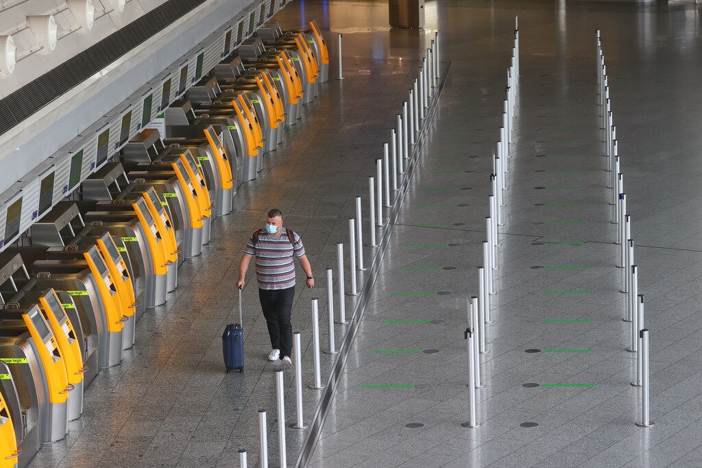 A traveler is seen at the airport in Frankfurt, Germany, May 20, 2020, as the spread of the coronavirus disease (COVID-19) continues. REUTERS/Kai Pfaffenbach - UP1EG5K0RQ92D