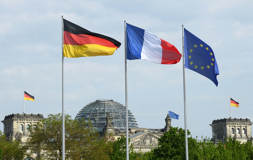 German, French and EU flags flutter in front of the Reichstag building ahead of a meeting with Western Balkans leaders, at the Chancellery in Berlin, Germany, April 29, 2019. REUTERS/Annegret Hilse - RC1AC7C22300