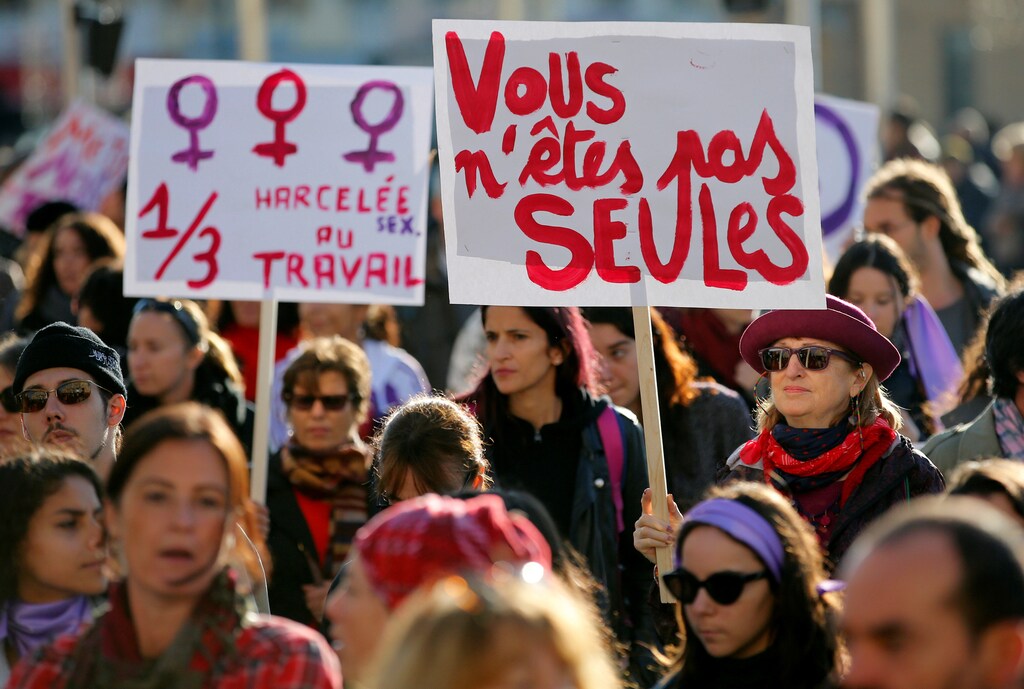 Demonstrators attend a rally against the gender-based and sexual violence against women in Marseille, France, November 24, 2018. The banners read "You are not alone" and "harassed at work". REUTERS/Jean-Paul Pelissier - RC14B3245570