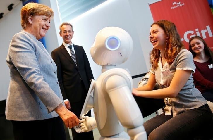 German Chancellor Angela Merkel talks to participants of a Girls' Day career event at the Chancellery to attract female pupils to careers in IT, technological and natural science sectors of the German industry in Berlin, Germany, April 26, 2017. REUTERS/Hannibal Hanschke