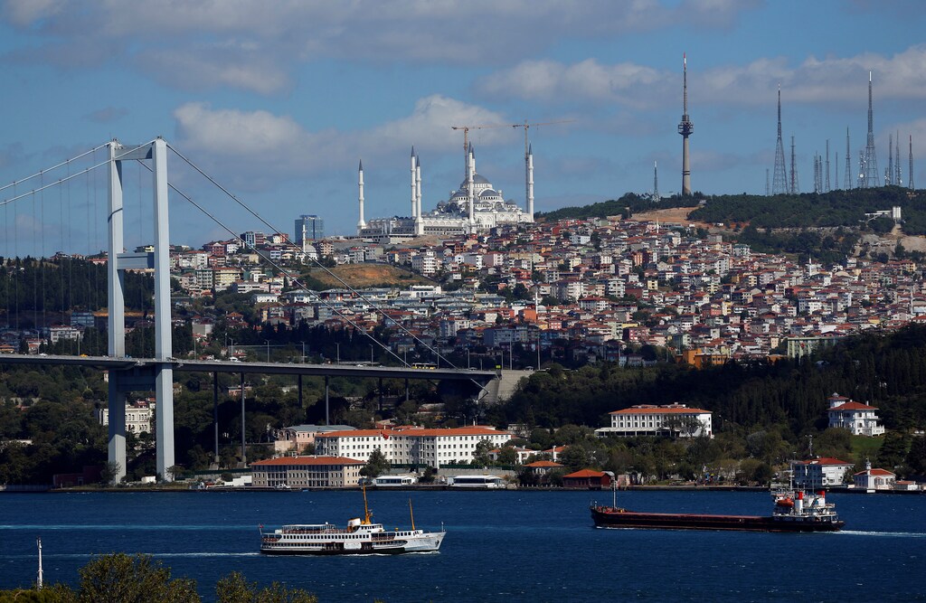 A ferry, with a new mosque under construction at Camlica hill in the background, sets sail in the Bosphorus in Istanbul, Turkey, July 31, 2017.