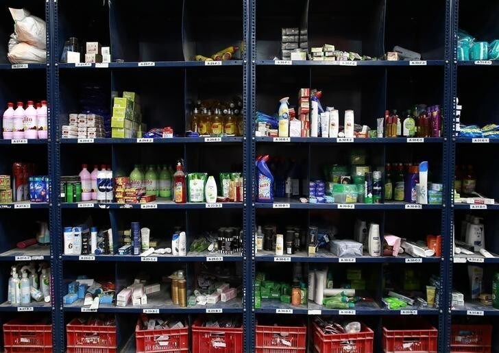 Goods are displayed on racks at a Big Basket warehouse on the outskirts of Mumbai November 4, 2014. Put off by snarled city traffic and a shortage of parking, more Indians are shopping for groceries online, helping e-tailers like Bigbasket.com and Localbanya.com turn in profits while supermarkets are struggling. Picture taken November 4. To match INDIA-INTERNET/RETAIL REUTERS/Danish Siddiqui (INDIA - Tags: BUSINESS)