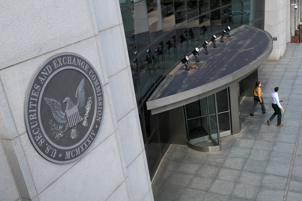 People exit the headquarters of the US Securities and Exchange Commission in Washington, D.C.