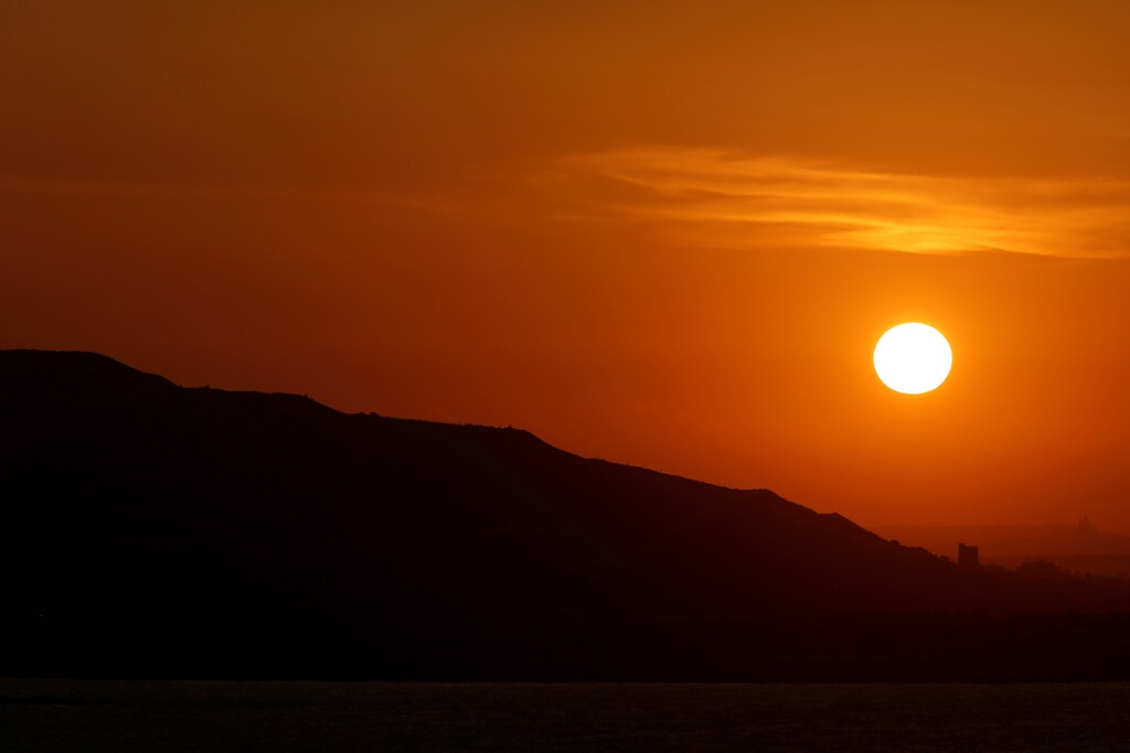 The decommissioned landfill of Maghtab, once Malta's largest dump, is seen at sunset from Pembroke, Malta June 7, 2017. REUTERS/Darrin Zammit Lupi - RTX39IOD