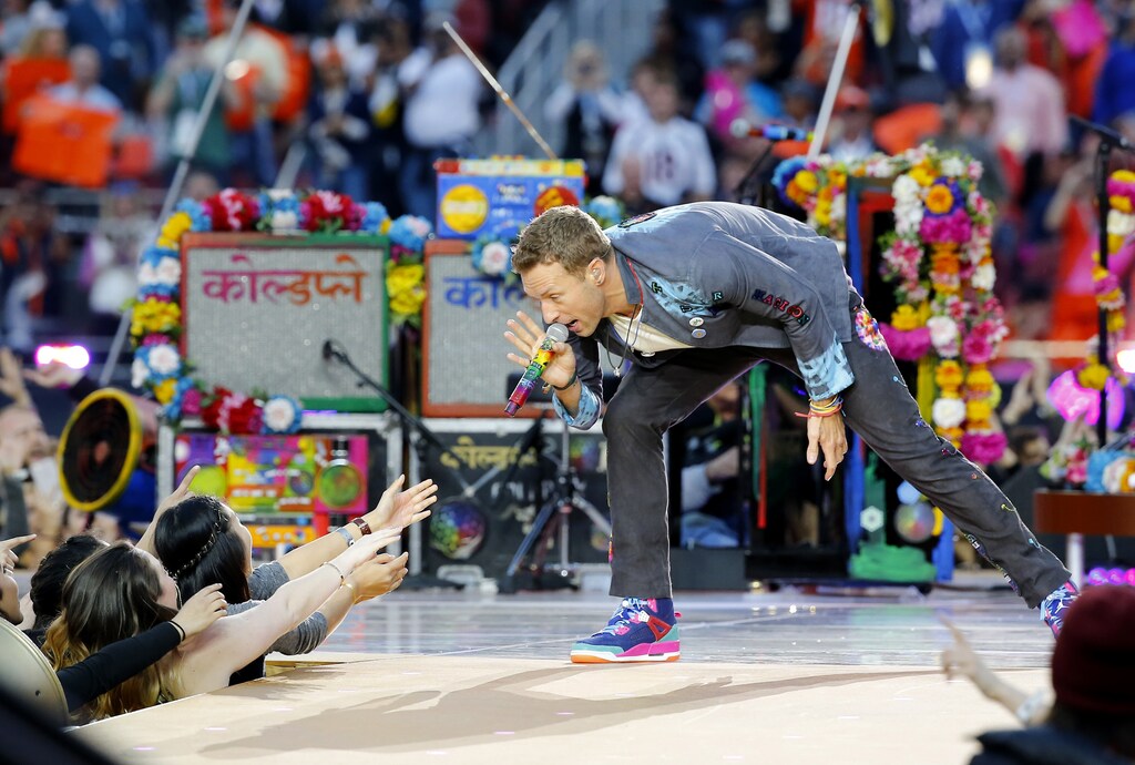 Chris Martin, lead singer of Coldplay, performs during the half-time show at the NFL's Super Bowl 50. The band will stop touring for now.
