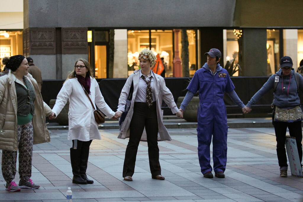Women hold hands and share personal stories during the Dress Like A Woman rally and march, held to support women's rights and to protest U.S. President Donald Trump, in Seattle, Washington, U.S. February 25, 2017.