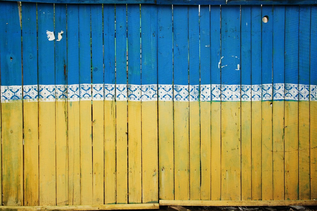 The fence of a construction site in Kiev is painted in the colours of the Ukrainian flag