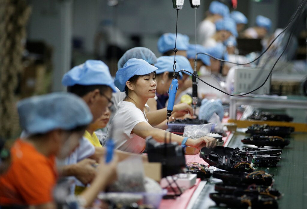 Employees work on the production line of a robot vacuum cleaner factory of Matsutek in Shenzhen, China August manufacturing countries exports production producing manufacture making factory china united states us u.s america north america japan Japanese Chinese germany german south korea south korean india india italy italian france french uk united kingdom britian great britian gb england ireland wales scotland mexico mexican