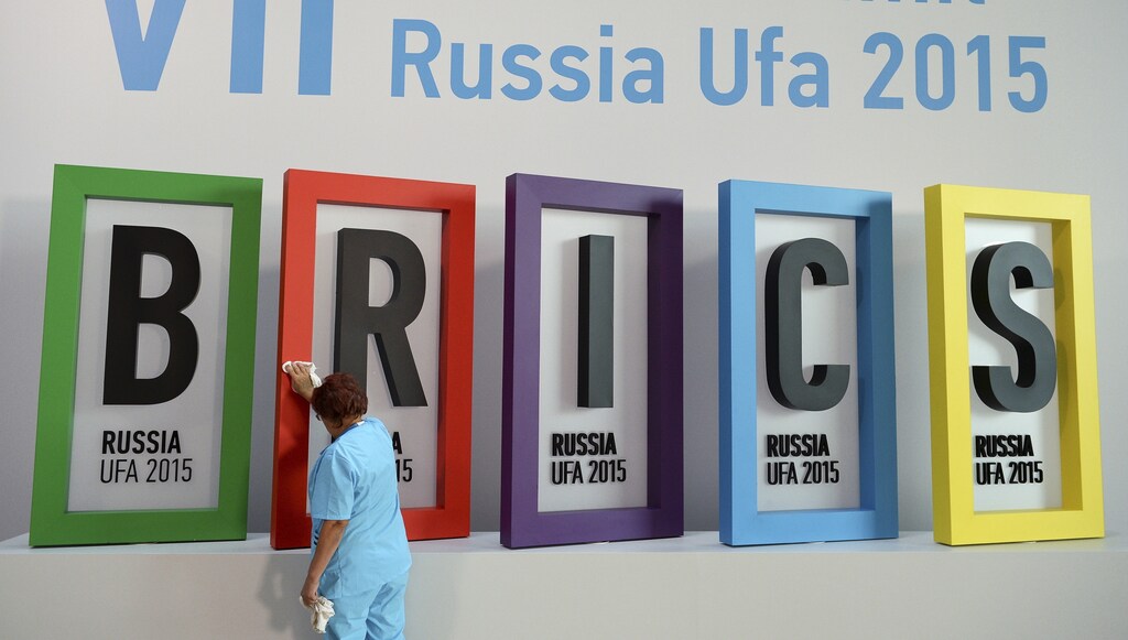 An employee cleans a board during the preparations for the BRICS summit in Ufa, Russia, July 7, 2015.