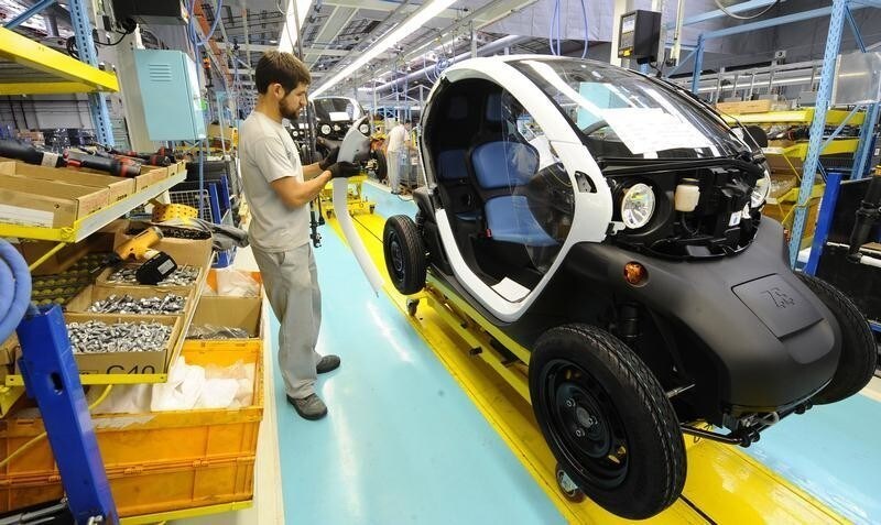 An employee works in the assembly of the new Renault Twizy Zero Emission electric car in Valladolid October 17, 2011. The first units of the Twizy car goes on sale in mid-November. REUTERS/Felix Ordonez (SPAIN - Tags: TRANSPORT ROYALS) - GM1E7AH1MT801