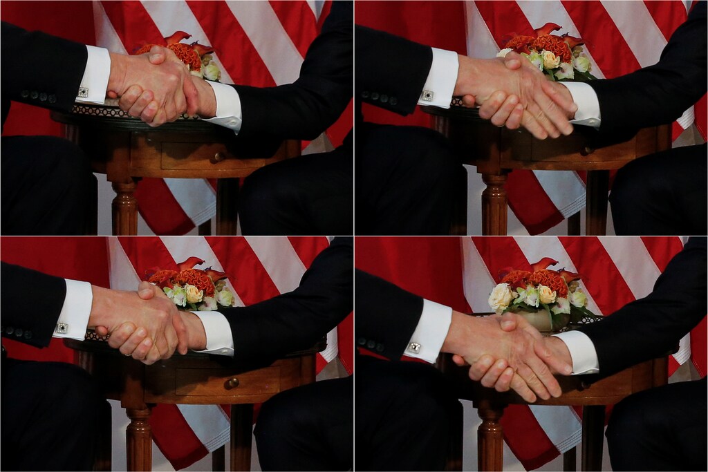 A combination photo shows U.S. President Donald Trump (L) trying twice to let go of a handshake with France's President Emmanuel Macron (R) as Macron holds tight, before a working lunch ahead of a NATO Summit in Brussels, Belgium, May 25, 2017. REUTERS/Jonathan Ernst TPX IMAGES OF THE DAY - RC18F0B65C10