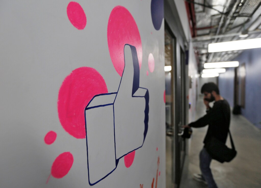 A man enters Facebook's new office in Mumbai, India May 27, 2016. REUTERS/Shailesh Andrade - RTX2EHLJ
