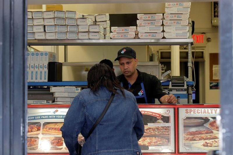 A customer makes an order at a Domino's Pizza restaurant in New York City, U.S., May 25, 2016. REUTERS/Brendan McDermid - RTSFXS5