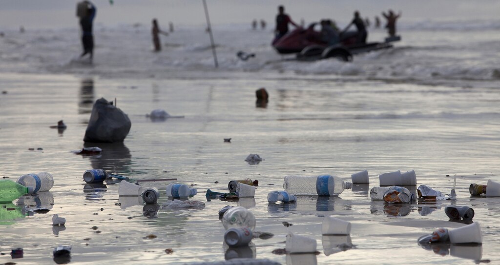 Trash is left scattered along Atalaia beach during the peak of the summer vacation season in Salinopolis, Para state, July 27, 2014.