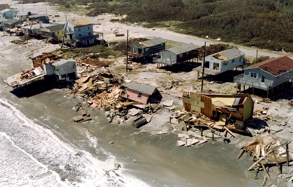 image of the remains of beach front houses lie on the sand in Surf City, North Carolina destroyed by the gale force winds of Hurricane Fran. The brunt of the winds and rain were felt the most by the outer banks islands in North Carolina.