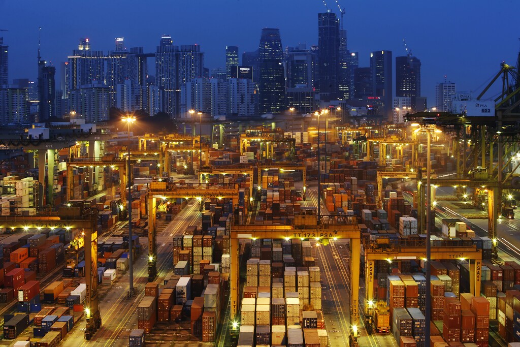The skyline of Singapore's central business district is seen at dusk as operations continue at a PSA International port terminal in Singapore September 25, 2013. Connected to more than 600 ports in some 120 countries, Singapore is one of the world's busiest shipping hubs, and is often called the gateway to Asia. It plans to increase its total capacity dramatically as it competes with other massive ports in the region such as Shanghai, Hong Kong and Shenzhen in China and Busan in South Korea. Picture taken September 25, 2013. REUTERS/Edgar Su (SINGAPORE - Tags: MARITIME BUSINESS SOCIETY TPX IMAGES OF THE DAY)ATTENTION EDITORS: PICTURE 17 OF 18 FOR PACKAGE 'SINGAPORE - GATEWAY TO ASIA'TO FIND ALL IMAGES SEARCH 'SINGAPORE GATEWAY' - GM1EA1S0UGO01