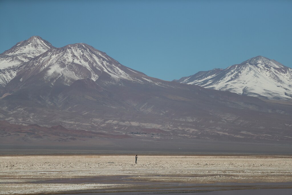 Reuters' journalist Dave Sherwood stands on the Atacama salt flat near Chaxa lagoon in the Atacama desert, Chile, August 15, 2018. REUTERS/Ivan Alvarado SEARCH "MINE LITHIUM" FOR THIS STORY. SEARCH "WIDER IMAGE" FOR ALL STORIES. - RC178AE22B10