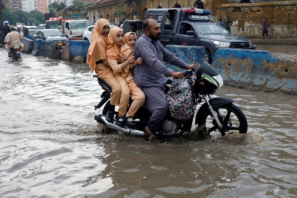 climate change Loss and damage motorcycle floods Pakistan