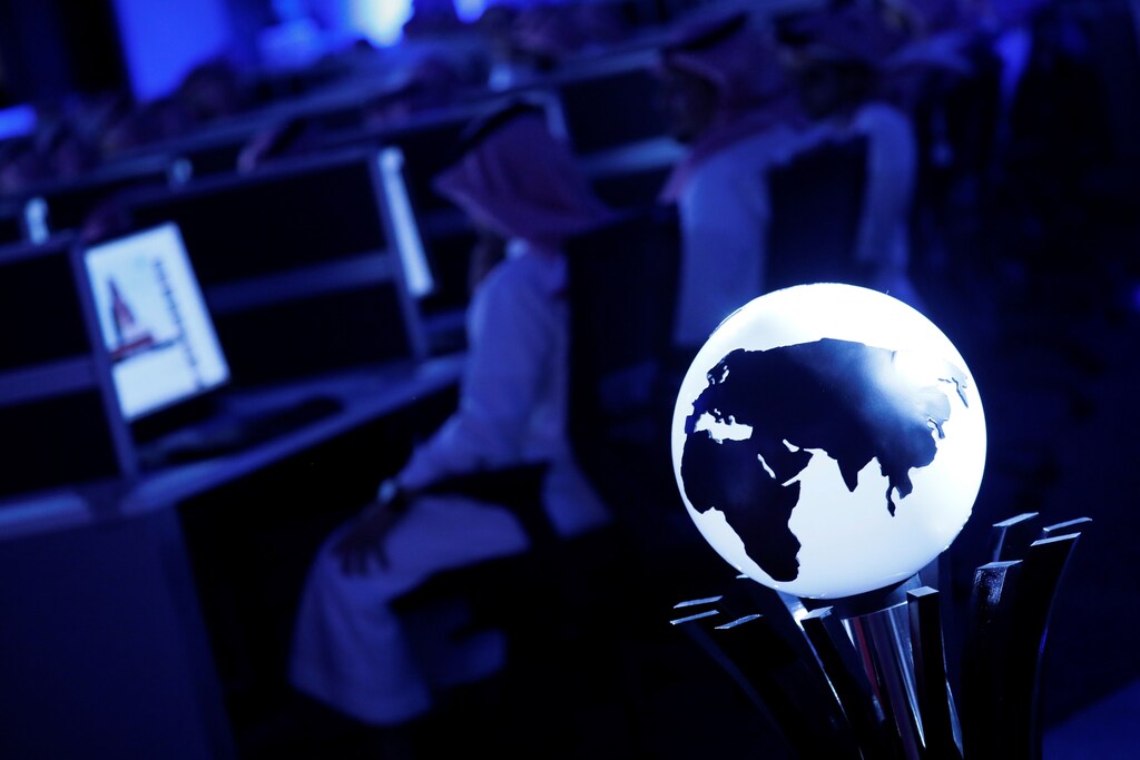 Data collectors sit at screens in new the Global Center for Combatting Extremist Ideology as they wait for a tour by U.S. President Donald Trump and Saudi Arabia's King Salman bin Abdulaziz Al Saud to commence in Riyadh, Saudi Arabia May 21, 2017. REUTERS/Jonathan Ernst TPX IMAGES OF THE DAY - RTX36WAD