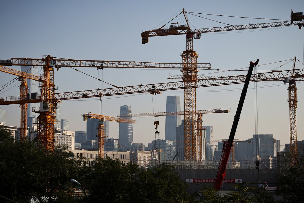 Some of the most exciting possibilities for the circular economy are in the construction sector. Pictured: A view shows cranes in front of the skyline of the Central Business District (CBD) in Beijing, China, October 18, 2021.