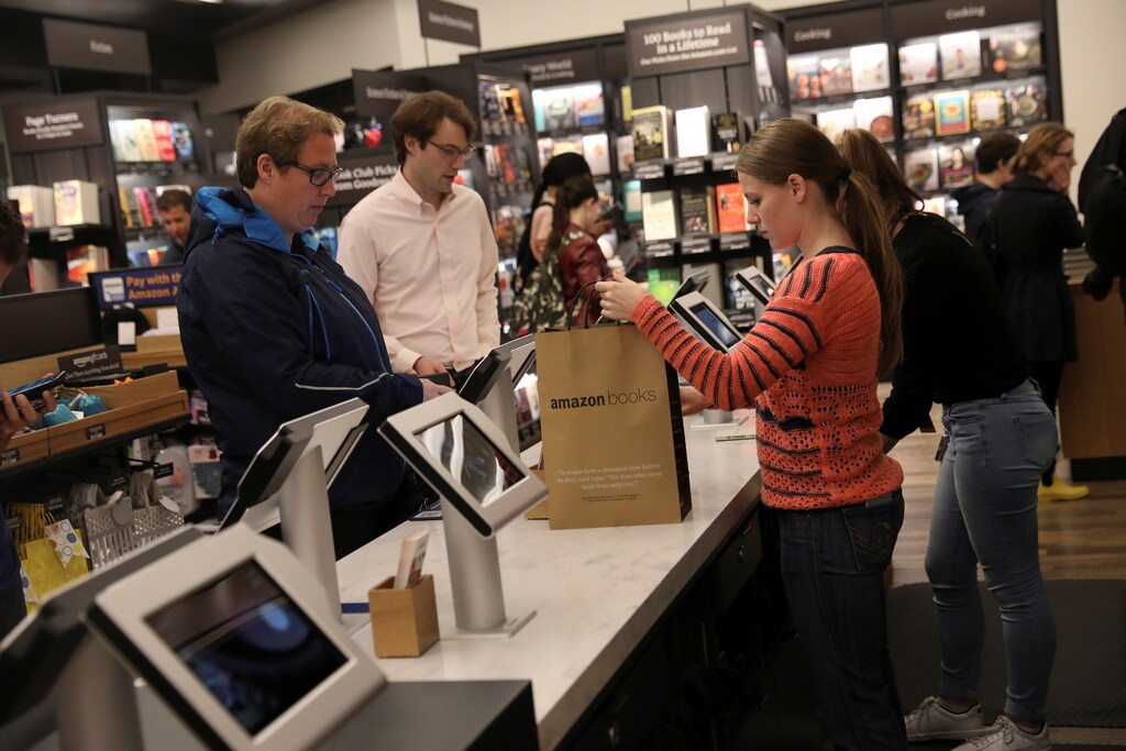 People shop at the Amazon Books store in the Time Warner Center at Columbus Circle in New York City, New York, U.S., May 25, 2017. REUTERS/Shannon Stapleton - RTX37MFB
