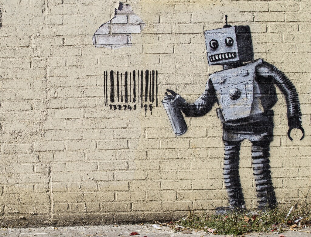 The newest art installation by British artist Banksy, a robot and a barcode, is seen on a wall in the Coney Island area of New York City, October 28, 2013. Famously jaded New Yorkers are getting swept up in the hype over Banksy, the renegade graffiti artist who is leaving his mark across the city this month. REUTERS/Brendan McDermid (UNITED STATES - Tags: SOCIETY) - GM1E9AT05UF01