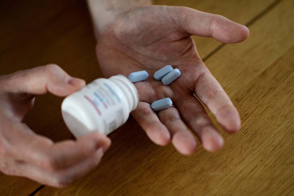 Will Nutland, who supports a drug-buying network and takes generic drugs himself to prevent HIV infection, shows off some of his generic drugs during an interview with Reuters at his home in central London, Britain November 3, 2016. Picture taken November 3, 2016. REUTERS/Dylan Martinez - S1AEULGIHPAA